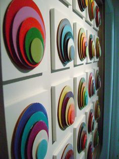 there are many colorful circles on the wall