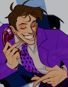 a man in a purple suit talking on a cell phone