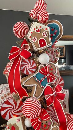 a christmas tree decorated with gingerbread cookies and candy canes