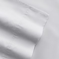 the white sheets are folded on top of each other in this close up shot,