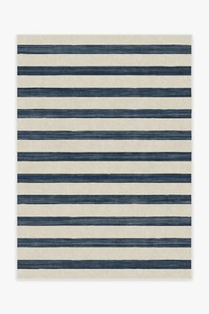 a blue and white rug with horizontal stripes