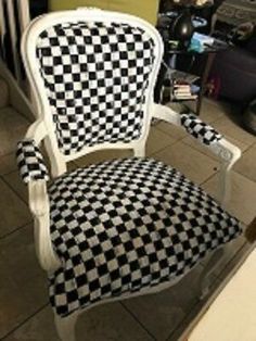 a black and white checkered chair in a room