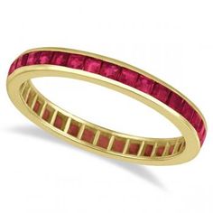 a yellow gold band with red stones