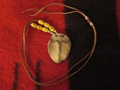 A physical and Sacred Journey In Relation to yours. Native American Suture Bone representing this Deer's path of life necklace the Physical and Spiritual Journey in relation to yours Native American Frontal Bone Deer's path of its life necklace Physical and Spiritual  The long squiggly rambling line represents the path the deer takes in its life and where the long rambling line splits into two squiggly lines one to the right and the other to the left and those line's represent a physical squiggl Frontal Bone, Squiggly Lines, Path Of Life, Spiritual Necklace, Made Jewelry, American Made, Dog Tag Necklace, Washer Necklace, Nativity