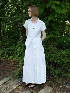 This is a feminine and minimal skirt by Laminez that is made out of high quality and sturdy material. With distinctive mood of the design and comfortable wear, you can style it for your comfortable daily outfit.- Tiered design and voluminous silhouette- Elastic waistband with belt loops- Shirring detail on the skirt- Casual and comfortable mood White Voluminous Maxi Skirt For Day Out, White Gathered Maxi Skirt For Day Out, White Voluminous Skirt For Day Out, White Relaxed Fit Skirt For Daywear, White Tiered Maxi Skirt For Daywear, White Relaxed Fit Long Skirt, White Voluminous Skirt For Daywear, White Cotton Maxi Skirt For Day Out, White Tiered Skirt For Workwear