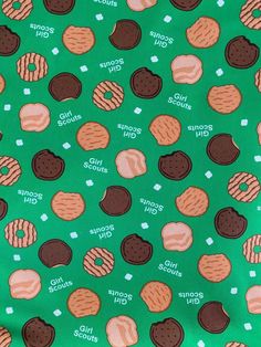 a green background with cookies and donuts on it