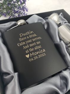 a flask and bottle in a gift box with the message dustin have a drink calm your eyes and meet me at the altar