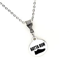 The is a beautiful jewelry piece that has a stainless steel laser engraved charm with "Gotta Run" on it. This necklace is a stainless  pendant on a stainless steel link chain with a silvertone bale.  This pendant is available on your choice of 16, 18, 20, 22, 24, 26, 28 or 30 inch chain.  The pendant is also available for individual purchase if you have another chain on which you would like to wear it. The pendant measures approx. 3/4 inch across. This jewelry item has small parts and is not int Running Necklace, Athlete Gifts, Track Team, Marathon Runner, Gifts For Runners, Marathon Runners, Wife Gift, Team Gifts, Daughter Gifts