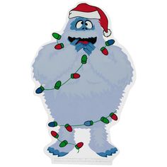 an image of a blue monster with christmas lights on it's legs and mouth