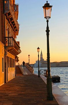 a street light sitting on the side of a pier