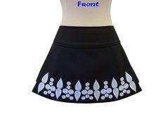 This fit-friendly Irish dance skirt is the perfect option for shows/competitions and will come in handy when your dancer is between dresses! The wrap-back style allows for an adjustable and comfortable fit. Crafted in the USA, this high-quality garment is made of black gabardine and features white embroidered crystal outlines and a Velcro closure around the back waist. Simply Prime skirts have two pleats in the front to allow for high kicks and quick movements. The skirts wrap around the back wi Fitted Flared Skort With Lined Skirt, Fitted Lined Skort, Fitted White Skort For Cheerleading, Stretch Skort For Dance, Embroidered Fitted Bottoms For Party, Elegant Embroidered Fitted Mini Skirt, Elegant Fitted Embroidered Mini Skirt, Fitted Mini Swim Skirt With Lined Skirt, Fitted Mini Swim Skirt With Lining