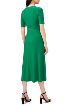 A defining tie belt tethers the waist of this day-to-night midi framed by abbreviated sleeves. 50" length V-neck Short sleeves 96% polyester, 4% spandex Machine wash, tumble dry Made in the USA Green Belted V-neck Maxi Dress, Fitted V-neck Midi Dress With Belt, Spring V-neck Dresses With Belted Cuffs, Belted V-neck Midi Dress, Green Belted Midi Dress For Evening, Formal V-neck Belted Dress With Tie Waist, Casual V-neck Dress With Belt, Solid Color Belted Midi Dress For Evening, Solid Belted Midi Dress For Evening