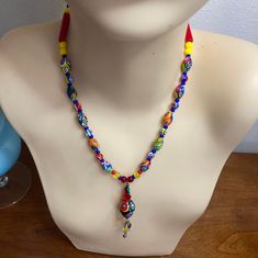 Vintage Beautiful Milifiori glass Beaded Necklace with easy on toggle Clasp. This Upscale Bright and bold piece has quality hand blown glass beads with abstract pressed fused florals. The Dangle Chandelier Pendant adds such a stylish interest! Would accessorize any clothing style with unique charm. Would look fantastic on a crisp white collared blouse. Measures 17" in length, pendant drops 2" and is 3/8 round. In new condition without any wear. Gifts for girlfriend, gift for BFF, gifts for Amon, Artistic Multicolor Beaded Necklaces, Colorful Adjustable Glass Beaded Necklaces, Artistic Adjustable Beaded Necklaces For Festivals, Artistic Adjustable Necklace With Colorful Beads, Artisan Adjustable Glass Beads, Multicolor Handmade Glass Beads, Bohemian Glass Beaded Chain, Artistic Adjustable Beaded Necklace With Round Beads, Traditional Multicolor Glass Beaded Necklaces