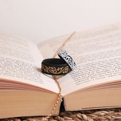 an open book with two bracelets on it