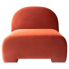 an orange couch sitting on top of a white floor