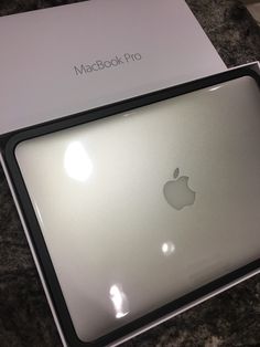 an apple macbook pro in its box