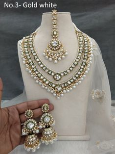 *Light Weight Kundan layered necklace set with earrings and tikka. *Studded with kundan stone. *Light Weight Gold kundan necklace. *No.1 to No.2 *Earrings Length- 3.2 inches(included pearl drop) *Earrings Dome Size- 1 inches *No.3 to No.5 *Earrings Length- 3.5 inches(included pearl drop) *Earrings Dome Size- 1 inches Gold White Wedding, Indian Jewelry Gold, Schmuck Gold, Necklace Set Indian, 2 Earrings, Layered Necklace Set, Kundan Necklace, Bangles Jewelry Designs, Aquamarine Crystal