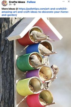 a bird house made out of tin cans with birds inside and in the nests