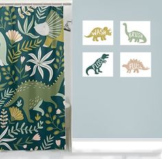 the shower curtain is decorated with dinosaurs and plants