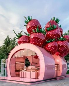 there is a pink structure with strawberries on it