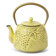 a yellow tea pot with a wooden handle