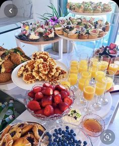 an assortment of desserts and pastries on a buffet table