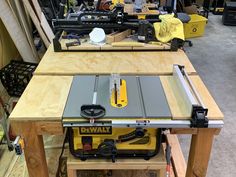 a table saw sits on top of a work bench