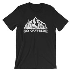 Go Outside ShirtThis Go Outside T-Shirt sends the perfect message to get outside and enjoy the finer things in life, fresh-air, sunshine.  It is even better when you can rock this shirt on a mountain hike or while camping.This t-shirt is everything you've dreamed of and more. It feels soft and lightweight, with the right amount of stretch. It's comfortable and flattering for both men and women. • 100% combed and ring-spun cotton (heather colors contain polyester)• Fabric weight: 4.2 oz (142 g/m2 Graphic Tee Shirt With Letter Print For Outdoor Activities, Outdoor Slogan Tops With Crew Neck, Black Tops With Text Print For Outdoor, Outdoor Cotton Shirt With Letter Print, Casual Hiking Shirt With Letter Print, Short Sleeve Letter Print Shirt For Hiking, Cotton Slogan Tops For Outdoor Activities, Black Top With Text Print For Outdoor Activities, Relaxed Fit Graphic Tee For Outdoor