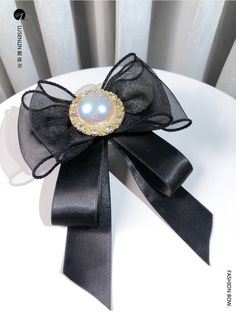 Attention: This price includes a brooch only, others are not included.Material: Alloy, ribbon.Size: 13*11cm.Hand measurement will have discrepancy of about 0.3cm.Weight: 20.6g. Black Brooch With Decorative Bow Gift, Black Brooch With Decorative Bow As Gift, Black Ribbon Brooches As Gift, Black Ribbon Brooches For Gift, Elegant Black Ribbon Hair Accessories, Gift Bow Brooch, Vintage Ribbon Brooches, Elegant Hair Accessories With Satin Bow As Gift, Black Bow Tie Brooch For Wedding