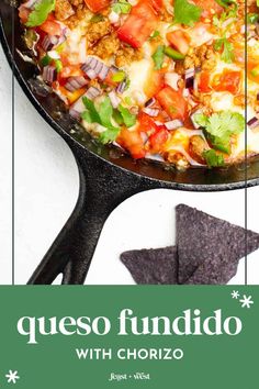 a skillet filled with mexican food and tortilla chips next to the words queso fundido with chorizo