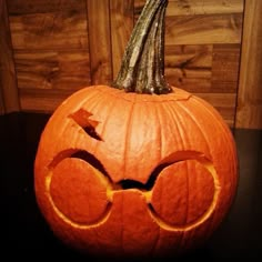 a pumpkin with glasses carved into it