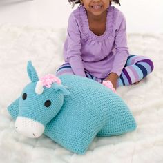 Free Easy Crochet Pillow/Pouf Pattern For KidsThis lovable crochet unicorn makes the best stuffed friend since it’s also a pillow that's perfect for hugging! An imaginative project, choose your shade of Red Heart Super Saver, or begin with the version shown. Or, invite your child to share their color pick. However you design it, shape this unexpected surprise to stimulate playtime, soothe at naptime or keep baby company when you're out and about.Material NotesDon’t forget to pick up the finishing touches for your project! Take a look at the list of supplies you’ll need that aren’t included in your kit. Kit does not include: Fiberfill Standard size pillow Two 1" buttons 1½" diameter or doll safety eyes Hook & loop fastener Black embroidery thread Unicorn Crafts For Kids, Crochet Pillow Patterns Free, Crochet Unicorn Pattern, Unicorn Pillow, Pillow Pals, Unicorn Crafts, Crochet Pillow Pattern, Easy Crochet Patterns Free, Crochet Pillows