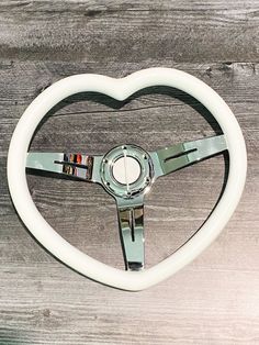 a steering wheel in the shape of a heart