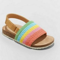 Gear Up Your Toddler For Sweet Sunny-Day Activities In These Josephine Rainbow Pattern Footbed Sandals From Cat & Jack. Featuring An Open Toe And Heel Design, These Sandals Sport A Contoured Footbed For Comfy Wear. Designed With A Flocked Outsole, These No-Heel Sandals Feature A Broad Instep And A Heel Strap With A Hook-And-Loop Closure For A Secure Fit And Easy On And Off. The Instep Is Designed With Woven Fabric Stripes In Rainbow Hues To Bring A Sweet Pop Of Color To Their Day. Available In A Multicolor Sandals For Spring Playtime, Multicolor Synthetic Sandals For Playtime, Casual Multicolor Sandals For Playtime, Playful Multicolor Sandals For Playtime, Playful Multicolor Sandals, Fun Sandals For Playtime In Spring, Multicolor Open Toe Sandals For Playtime, Fun Playtime Sandals For Spring, Cute Sandals For Playtime In Spring