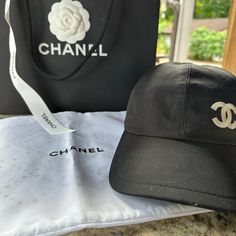 Chanel Logo Hat. Excellent Used Condition. I Wore It While Going Through Chemo, When I Was Bald, It’s Just Been Sitting Since. Includes Hat, Dust Bag, Camila, Shopping Bag And Ribbon. I Purchased Directly From The Chanel Boutique Chanel Boutique, Chanel Logo, Chanel Accessories, Dust Bag, Chanel, Women Accessories, Hats, ? Logo, How To Wear