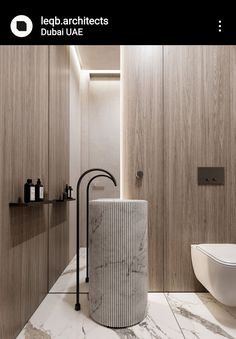 a bathroom with marble flooring and walls