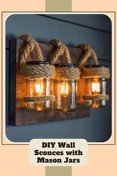 mason jar lights are hanging on a wall