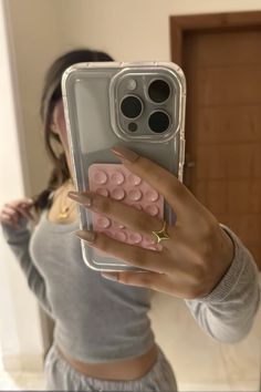 a woman taking a selfie with her phone case in front of her face and holding it up to the camera