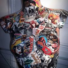 a woman's torso covered in various stickers