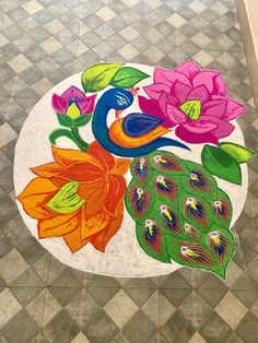 a colorful painting on the ground in front of a tiled floor with flowers and leaves