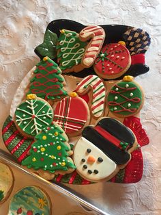 decorated christmas cookies are sitting on a table