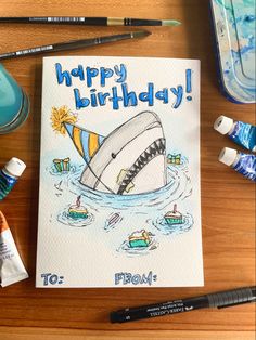 a birthday card with an image of a shark in the water and other items around it