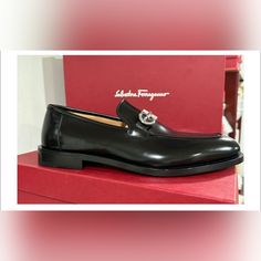 Salvatore Ferragamo New With Original Box Multiple Sizes Style Ree Color Black Luxury Black Loafers With Leather Lining, Luxury Loafers With Red Sole For Business, Luxury Business Loafers With Red Sole, Luxury Loafers With Red Sole And Plain Toe, Luxury Loafers With Red Sole, Luxury Formal Loafers With Branded Insole, Designer Formal Loafers With Rubber Sole, Elegant Business Loafers With Red Sole, Luxury Slip-on Dress Shoes