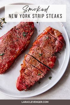 two steaks on a white plate with the words smoked new york strip steaks