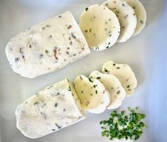 four pieces of food on a plate with parsley