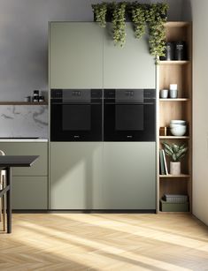 a kitchen with an oven and cabinets in it