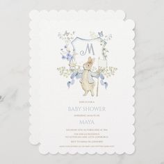 a baby shower is shown with the letter m on it's front and bottom corner