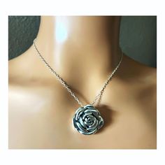 Elevate your jewelry collection with our exquisite Rose Flower Pendant Necklace, masterfully crafted from premium 925 Sterling Silver. This hollow-formed pendant showcases an intricate rose design, offering an elegant and timeless aesthetic. The pendant dimensions are a tasteful 1 inch by 1 inch, perfect for making a subtle yet impactful statement. For a harmonious look, you have the option to pair the pendant with a matching 18-inch cable link necklace, also fashioned from high-quality 925 Ster Rose Sterling Silver Necklace For Gift, Rose Pendant Necklace In Sterling Silver, Rose Sterling Silver Necklace For Anniversary, Rose-colored Sterling Silver Necklace For Anniversary, Elegant Rose Jewelry For Mother's Day, Sterling Silver Necklace With Rose Flower Pendant, Sterling Silver Rose Necklace With Rose Design, Sterling Silver Necklace With Rose Design In Rose Color, Silver Round Pendant With Rose Design