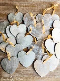 several heart shaped ornaments on a wooden table