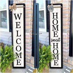 two wooden signs that say welcome home and sweet home on the side of a house